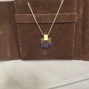 Hermes silver tone necklace with white enamel accent